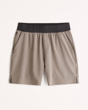 Brown Abercrombie And Fitch Ypb Motiontek 7 Inch Unlined Training Men Shorts | 85QALTRGU